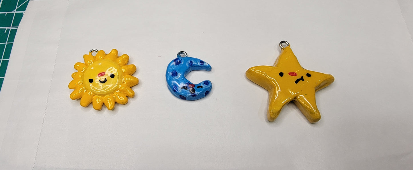 sun, moon, and star clay charms