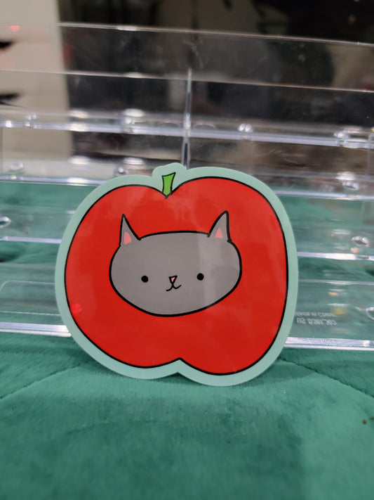 cat dressed as an apple sticker