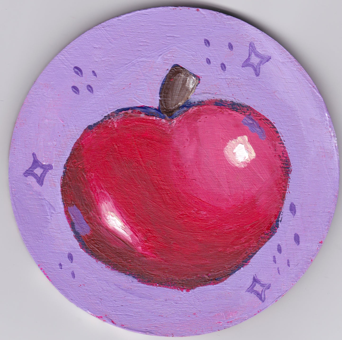 apple on wood plate