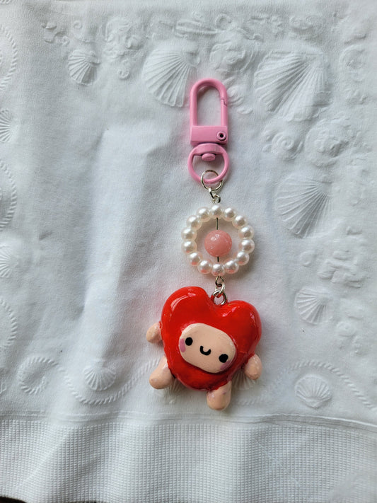 cute lil guy in a heart costume