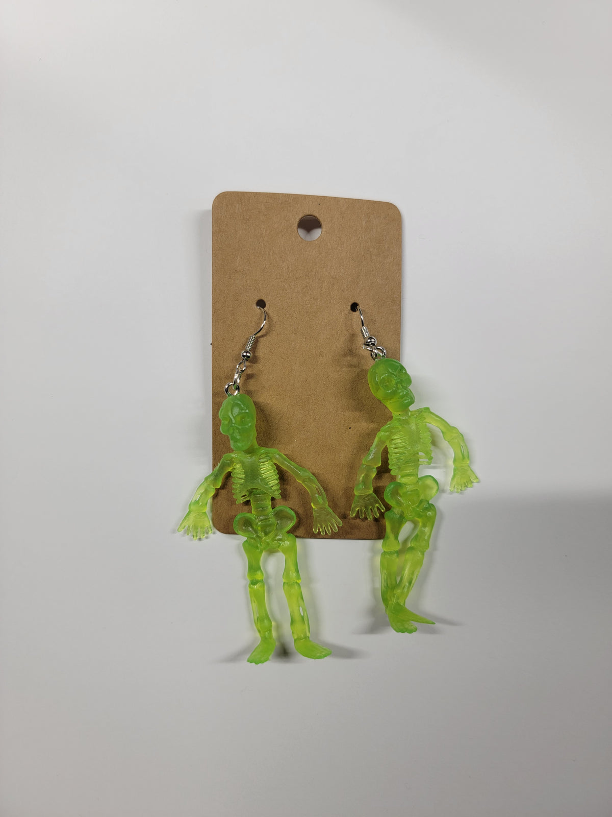 neon green skeleton dangle earrings